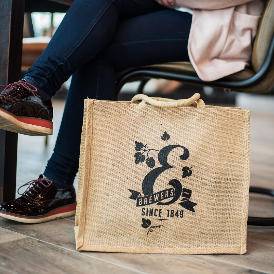 e jute shopper bag on ground next to seat