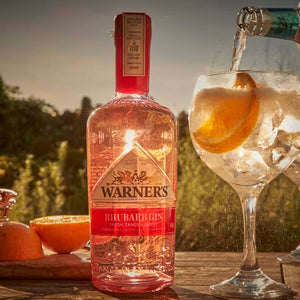 Warner's Rhubarb Gin in glass next to bottle
