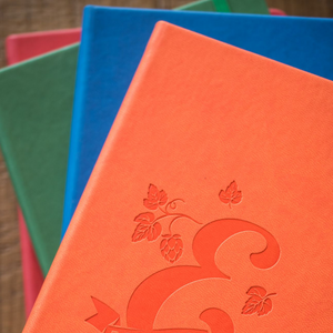 Four notebooks with E logo
