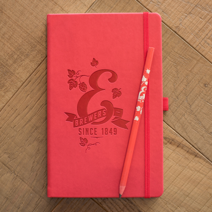 Red notebook and pencil