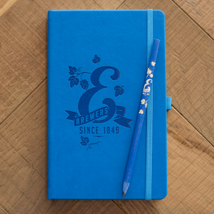 Blue notebook and pencil